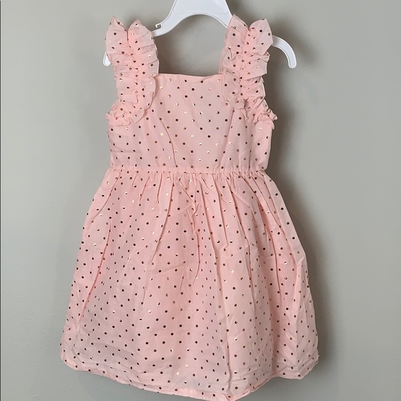 pink dress with gold polka dots